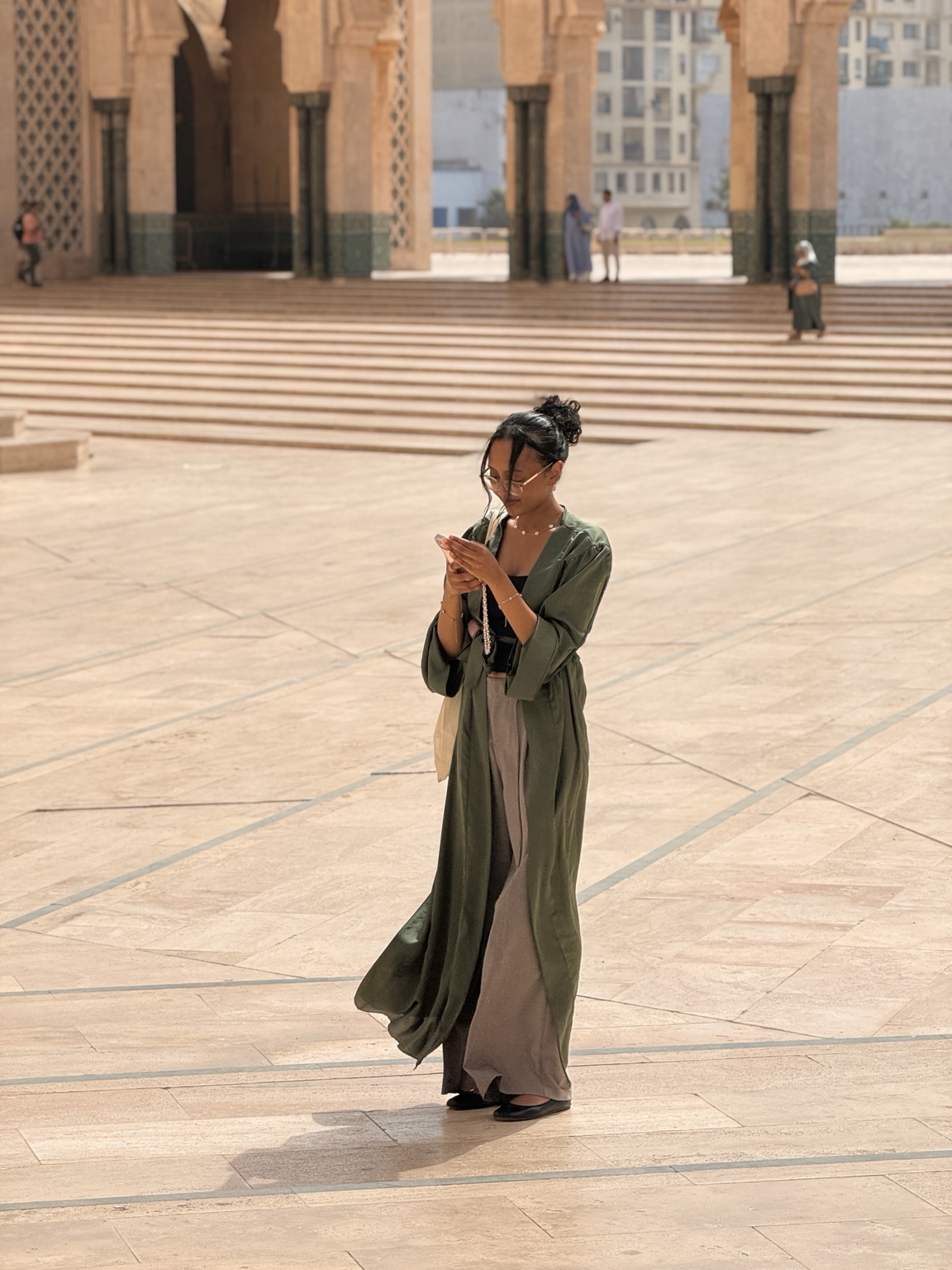 A sunlit portrait in a grand courtyard